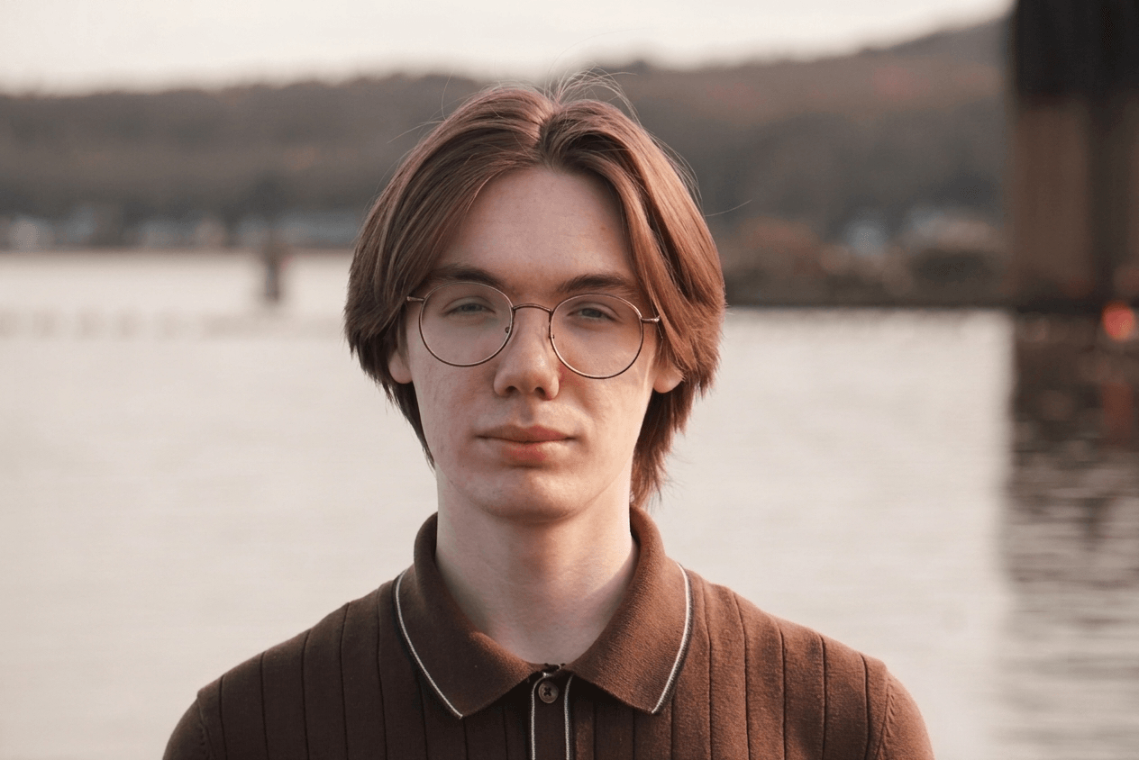 William Block, founder of Tabby Studios, standing outside near the water in Marquette